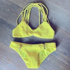 Tori Praver, 2 piece yellow knit zip side bikini. Size XS